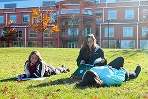 Students reading in front of Wooster Hall