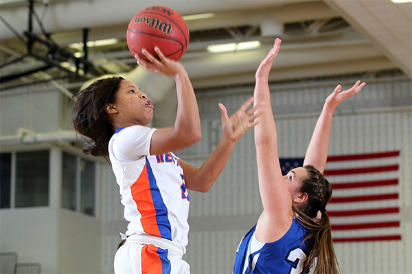 Goldie Harrison plays basketball 