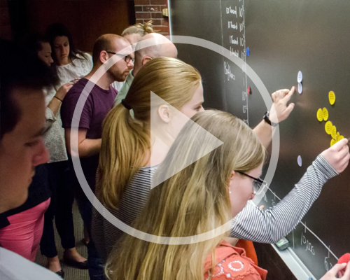 School of Education - students at a chalk board