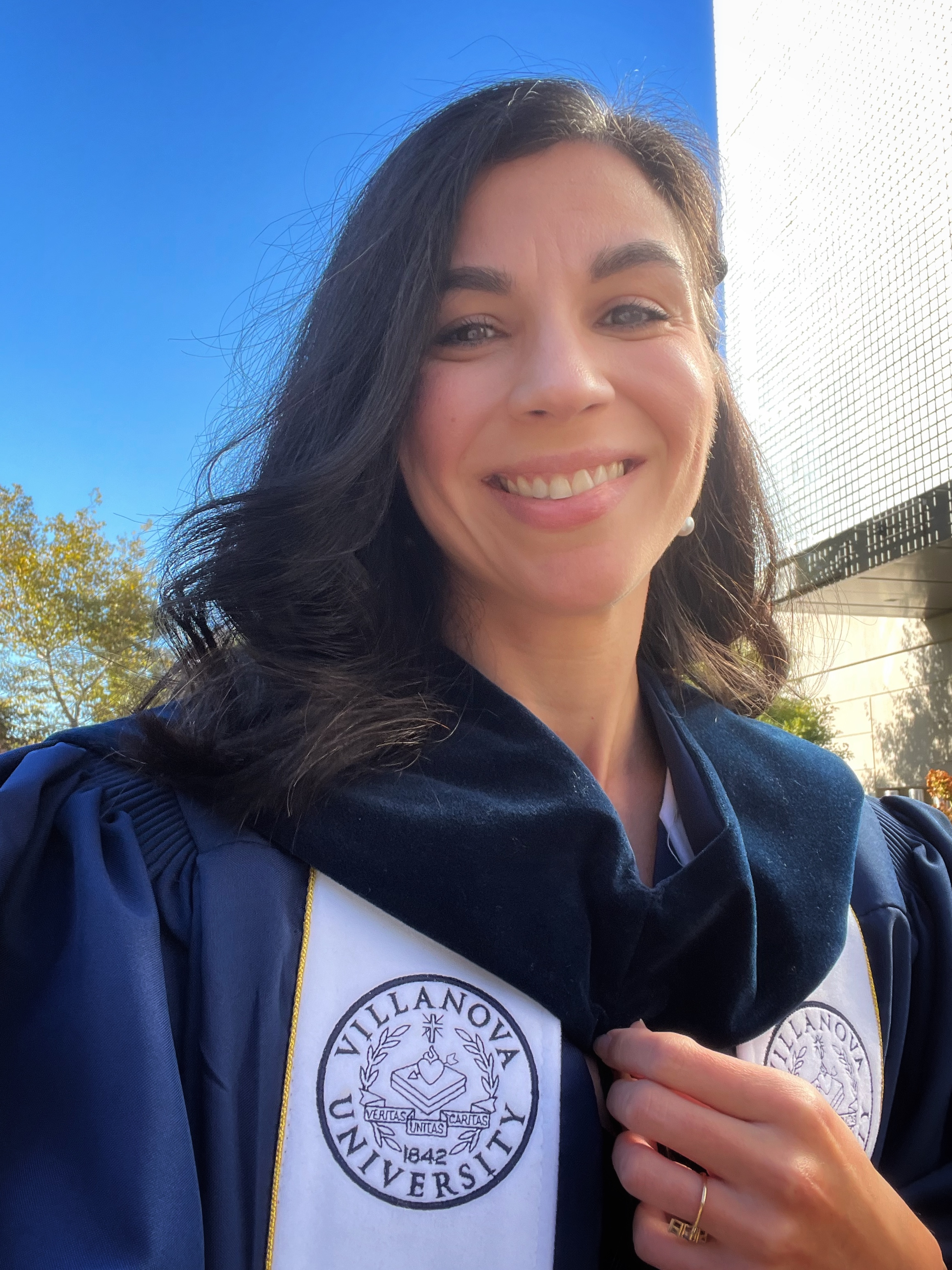 smiling woman in academic robes