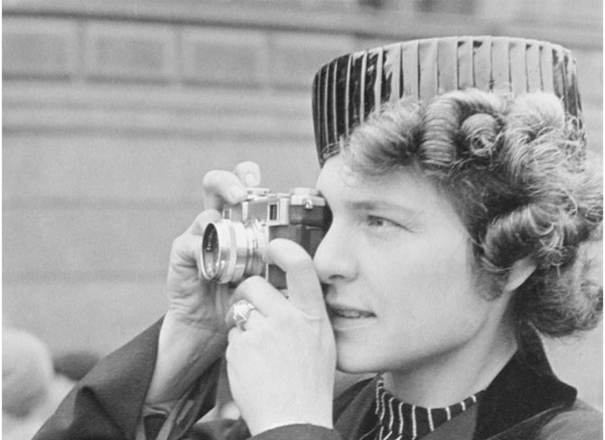 Photographer Margaret Bourke-White looking through a view finder