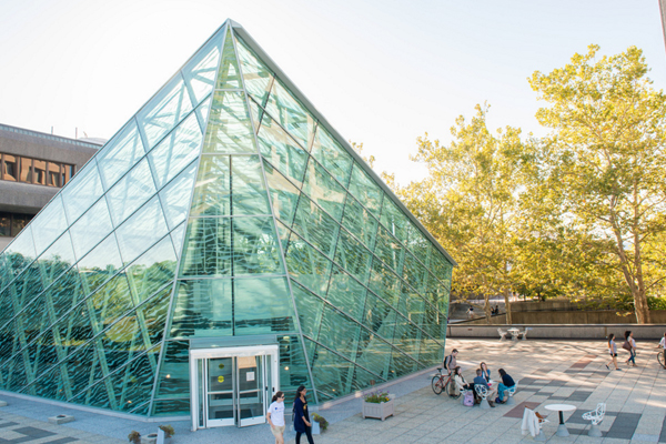 Atrium during the day, with students walking through campus