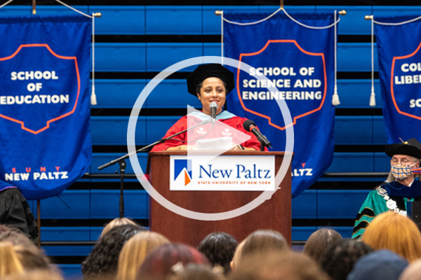 Liz speaking at podium