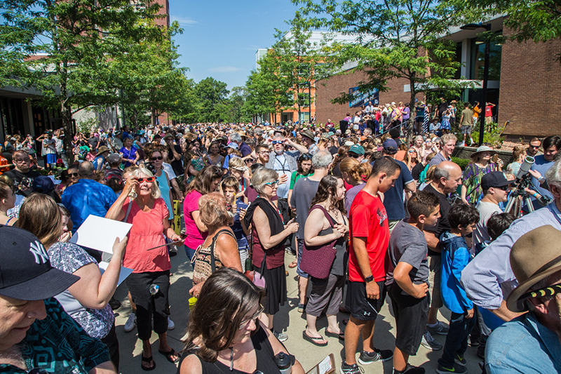 Crowd of people on campus for the solar eclipse