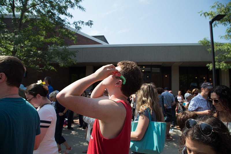 Student looking through special glasses