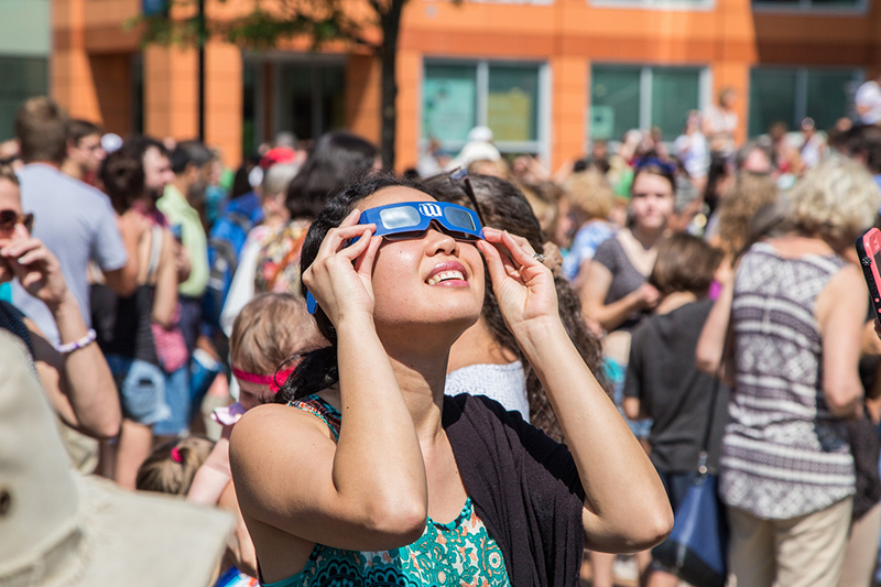 Student looking through special glasses