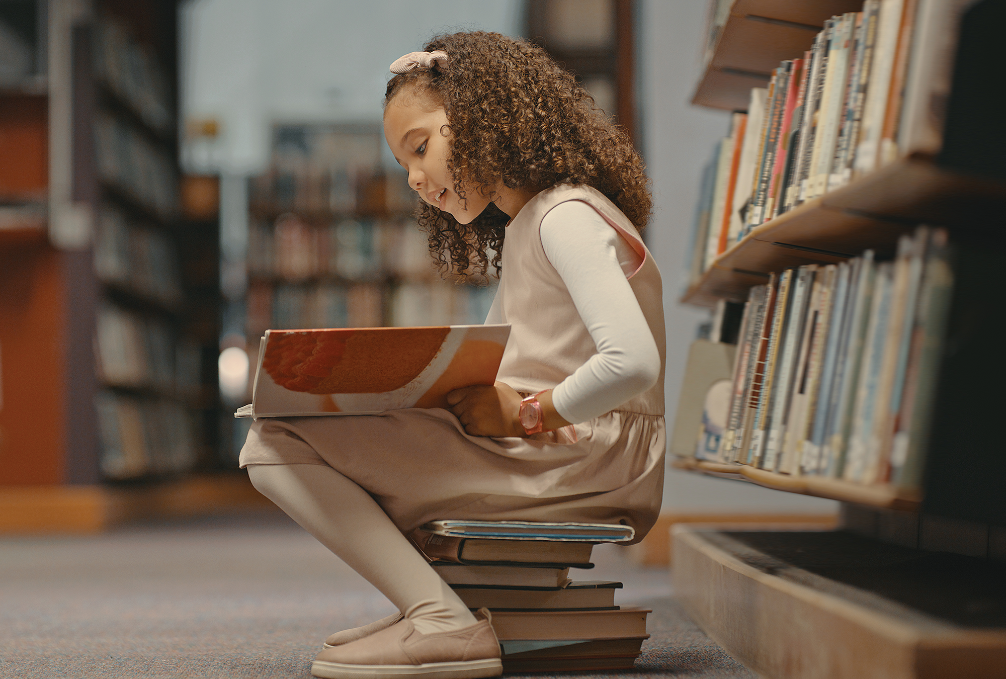 A girl reading in a library