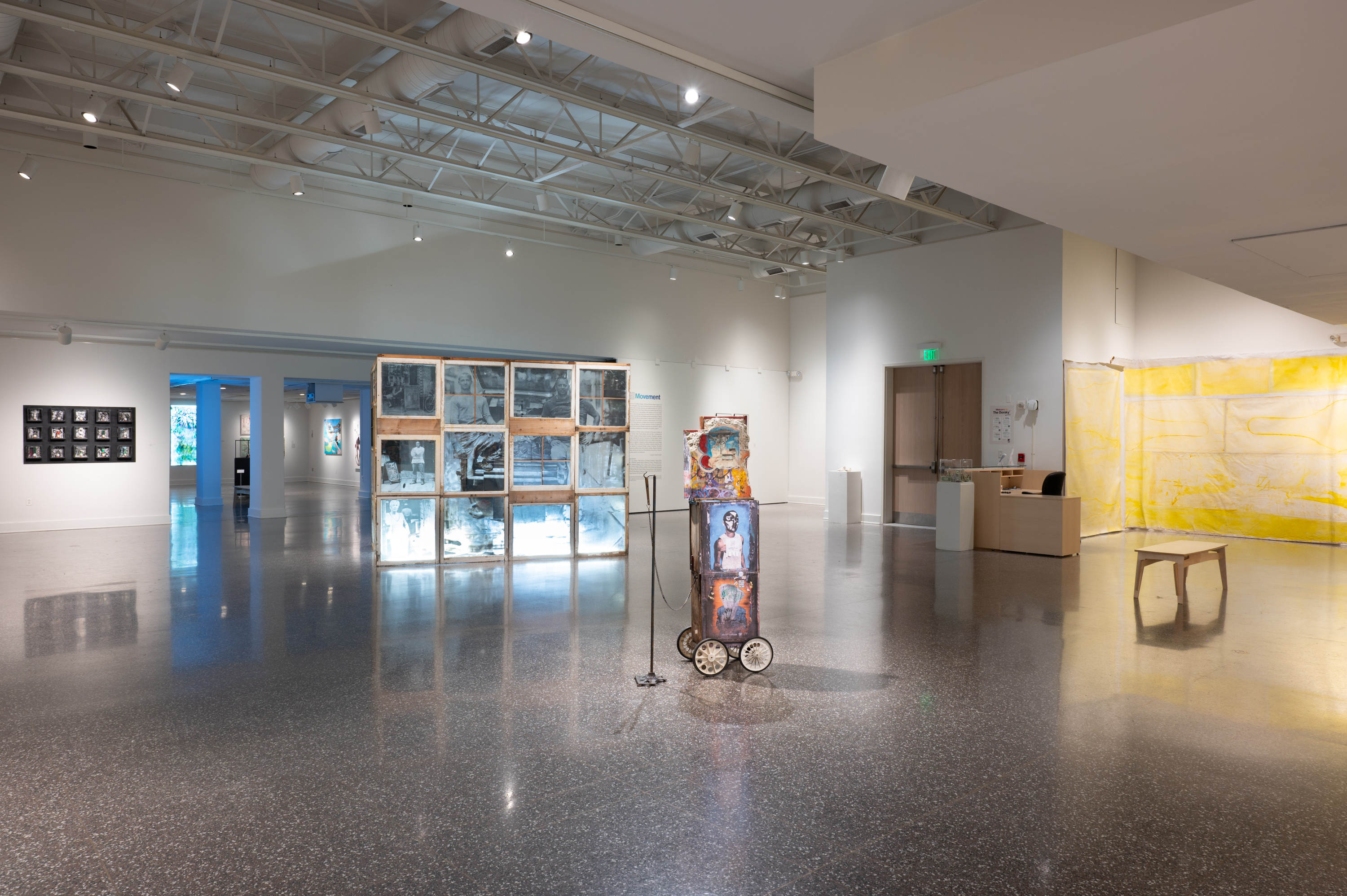 Overview of a spacious gallery in Hudson Valley Artists: 2025, with paintings, videos, and floor-based installations.