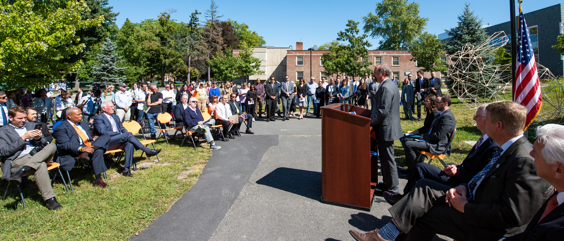 Dean Freedman speaking to the audience at the Ribbon Cutting Ceremony