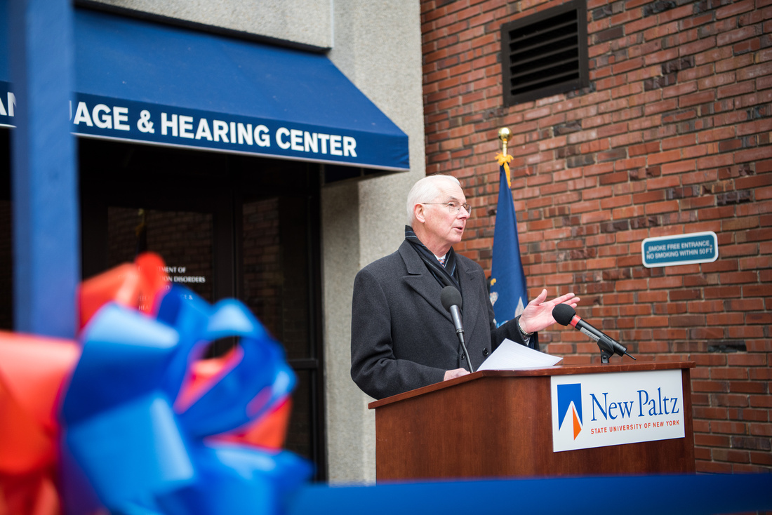 President Donald P. Chrisitan speaks at the podium during the speaking portion of the event