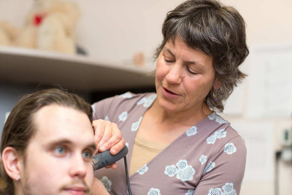 student receiving a hearing exam