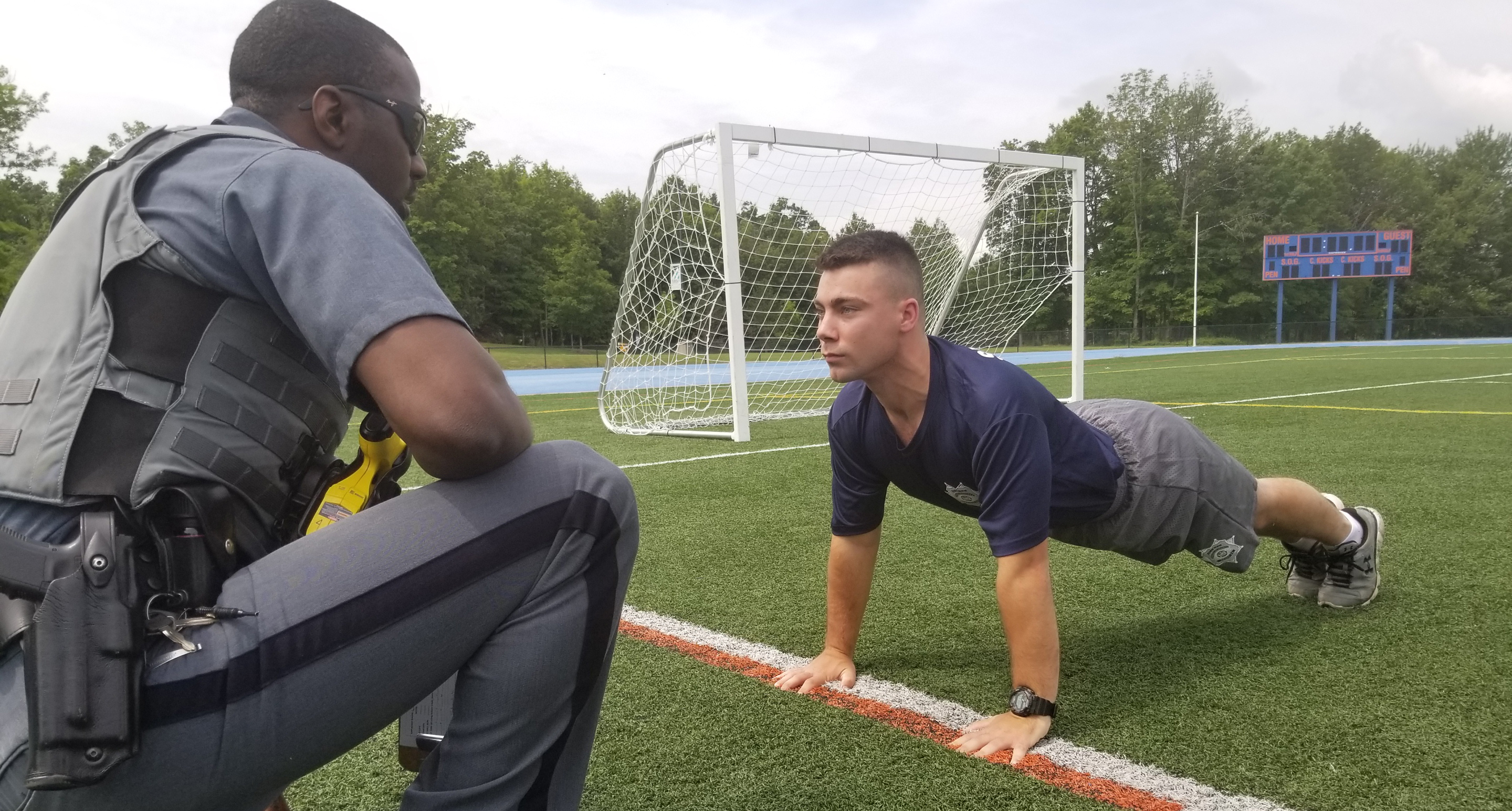 Police training on an athletic field