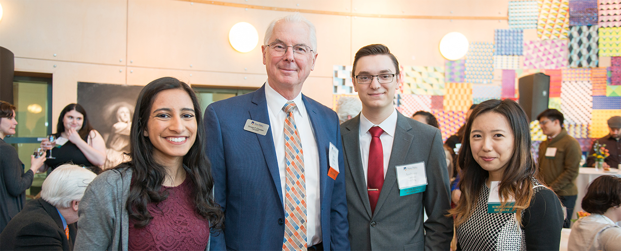 President Christian stand with students at event