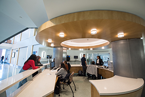 students standing at the Wooster Hall help desk