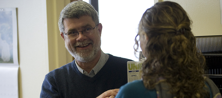 Student and professor speaking with each other