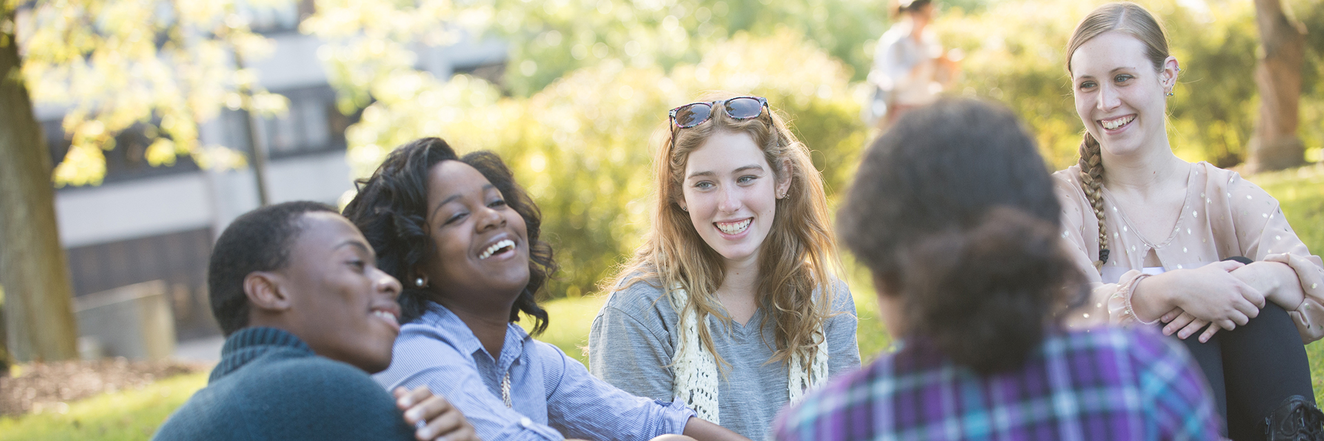 Students sitting together on lawn