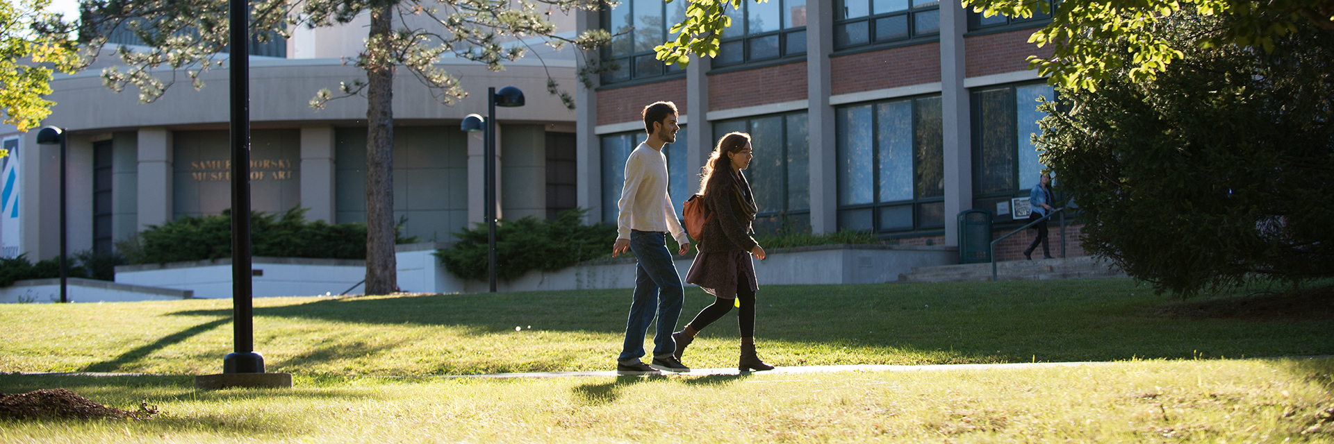 Two students walking on campus