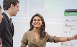 A student pointing to white board